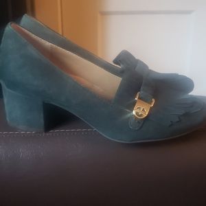 Green suede loafer.